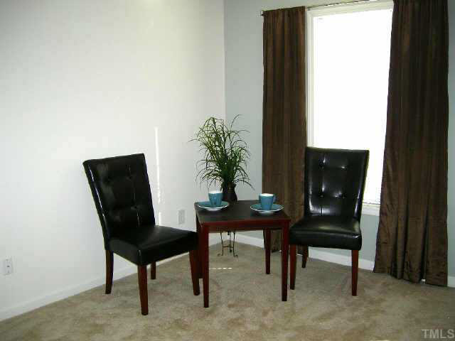 11321 Clubhaven Place Raleigh, NC 27617 - Photo 8 of 10 a view of a workspace room with furniture and a potted plant