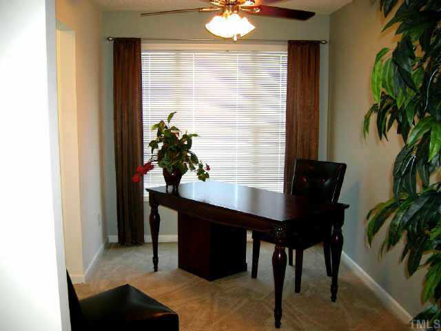 11321 Clubhaven Place Raleigh, NC 27617 - Photo 10 of 10 a view of a room with furniture and a potted plant