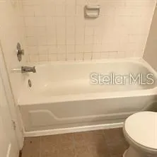 a close view of a bathtub in bathroom
