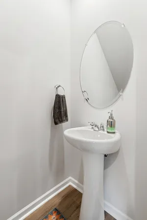 a bathroom with a sink and mirror