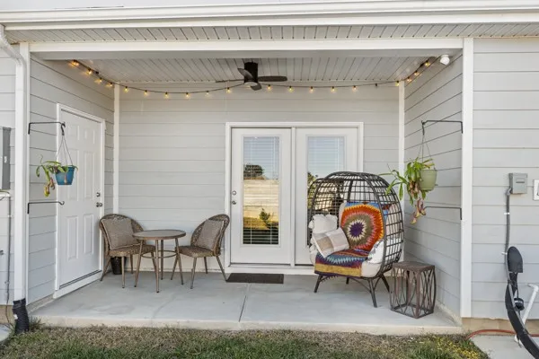 a view of a livingroom with furniture and front door