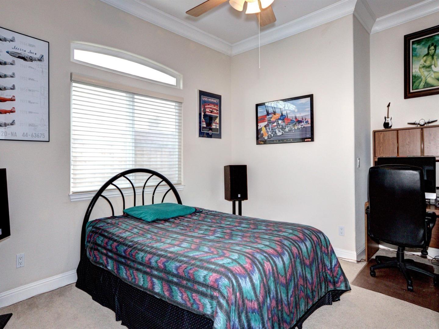 10340 Moretti Drive Cupertino, CA 95014 - Photo 14 of 18 a bedroom with a bed and a flat screen tv