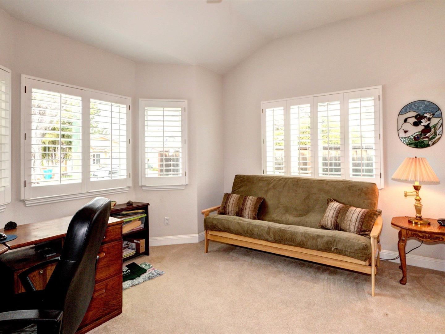 10340 Moretti Drive Cupertino, CA 95014 - Photo 16 of 18 a living room with furniture and a window
