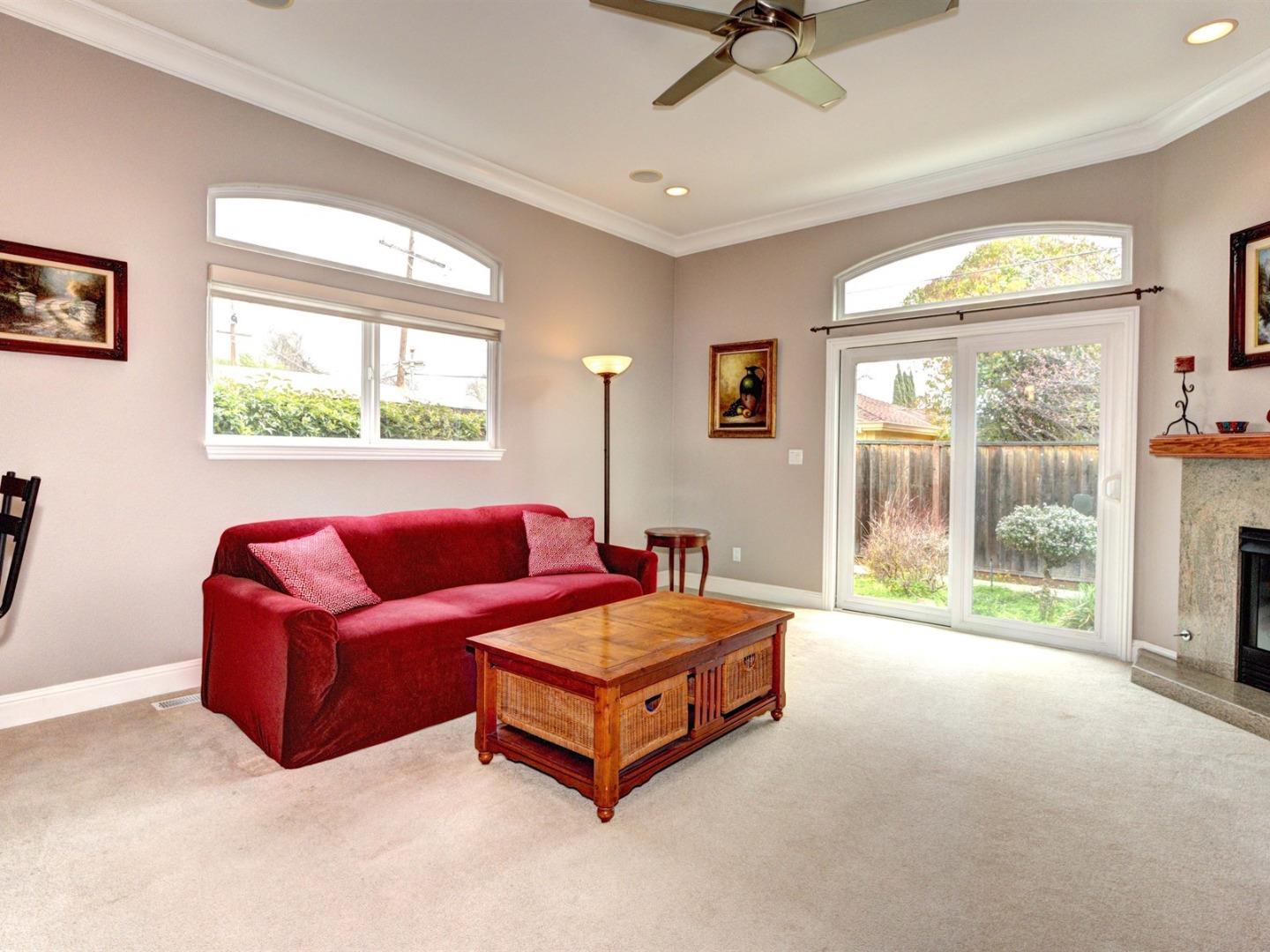 10340 Moretti Drive Cupertino, CA 95014 - Photo 3 of 18 a living room with furniture and a large window