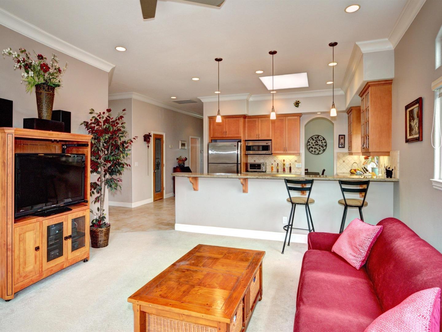 10340 Moretti Drive Cupertino, CA 95014 - Photo 5 of 18 a living room with furniture and a flat screen tv