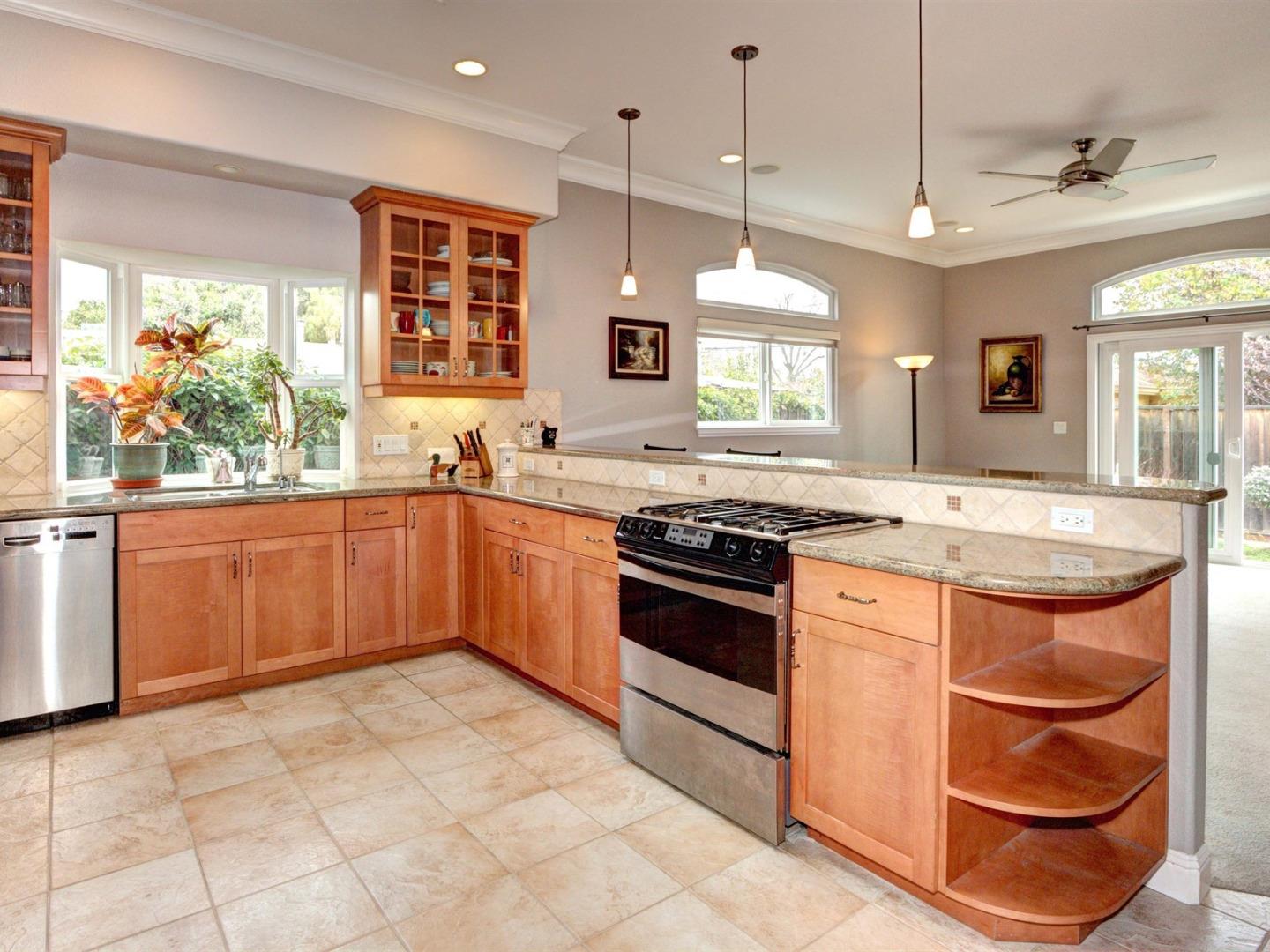 10340 Moretti Drive Cupertino, CA 95014 - Photo 7 of 18 a kitchen with stainless steel appliances granite countertop a sink and a stove