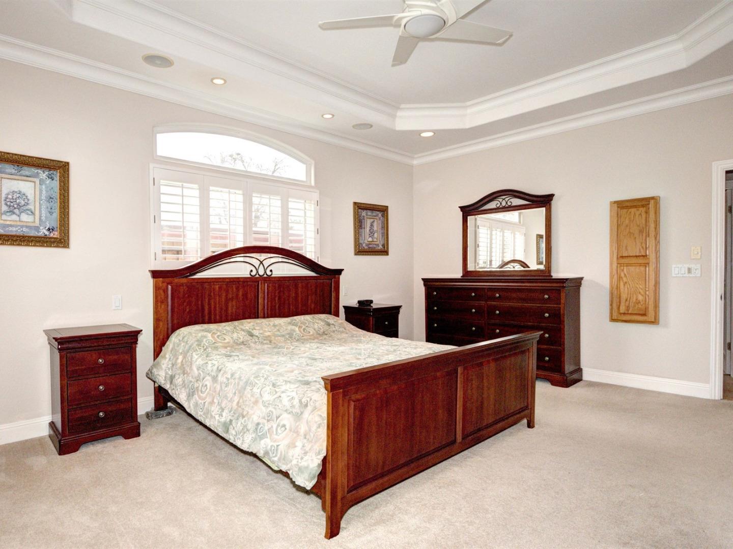 10340 Moretti Drive Cupertino, CA 95014 - Photo 10 of 18 a bedroom with a bed and a dresser