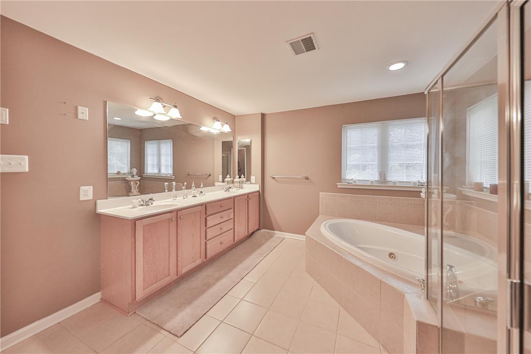 138 Clover Hollow Road Easton, PA 18045 - Photo 49 of 95 Indulge in a tranquil primary bathroom retreat with a spacious soaking tub and dual vanities.