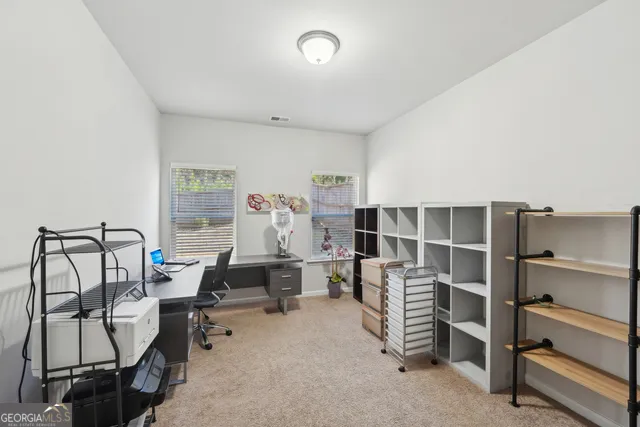 a front view of a house with yard and garage