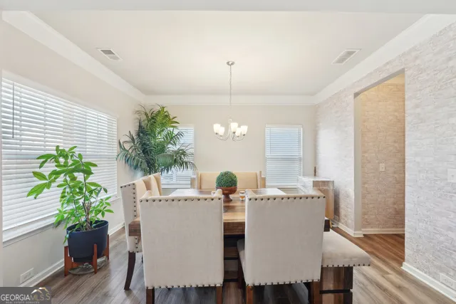a bathroom with a double vanity sink mirror and shower