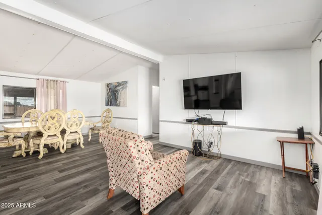 a living room with furniture and a table