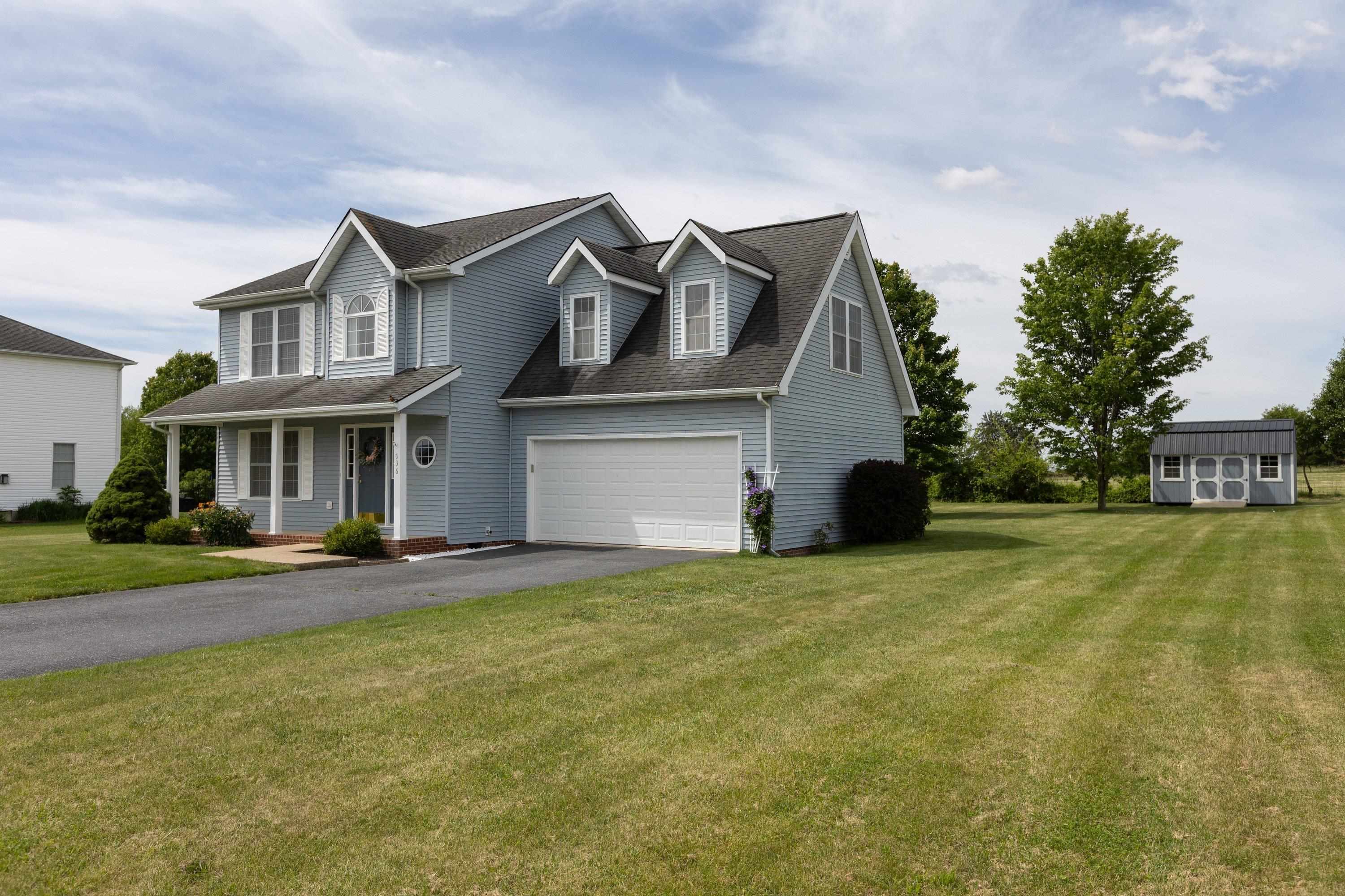 536 Three Leagues Road McGaheysville, VA 22840 - Photo 1 of 71 a front view of a house with a garden and yard