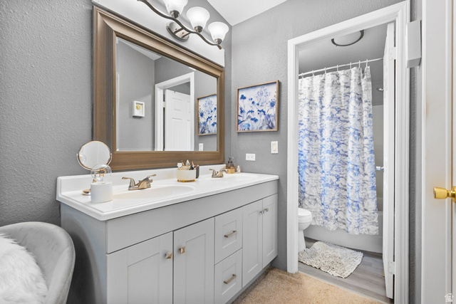 271 Mindella Way Layton, UT 84041 - Photo 17 of 27 Bathroom featuring a light gray dual vanity with white countertops, a large framed mirror, and chrome fixtures