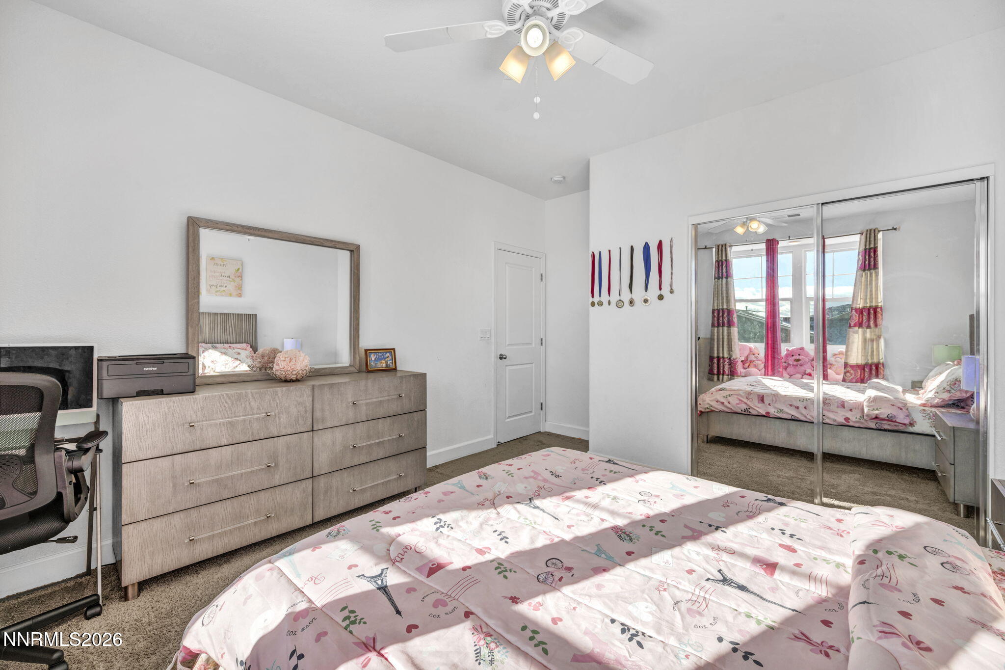 969 Estuary Circle Reno, NV 89506 - Photo 22 of 38 a bedroom with a bed and a dresser