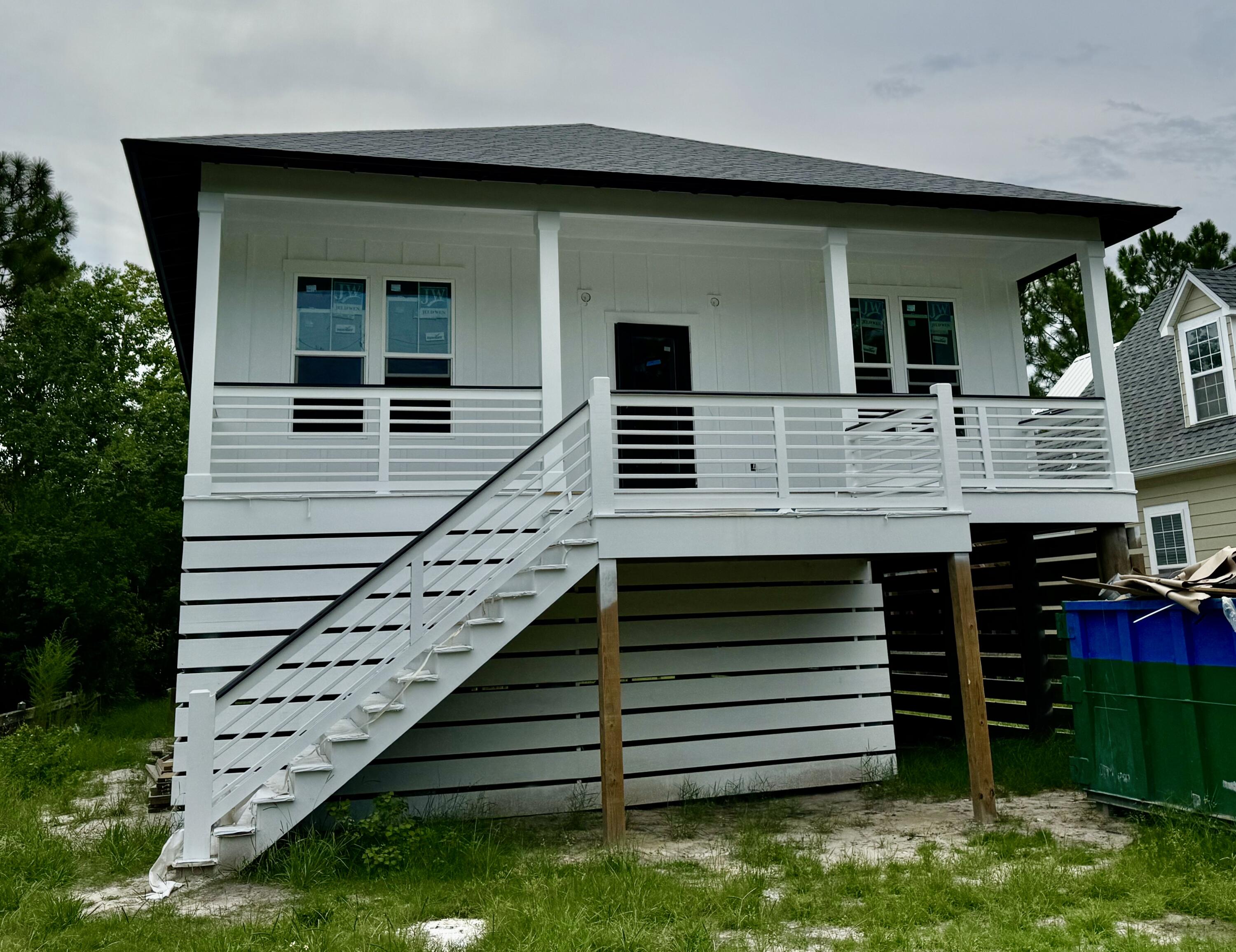 179 6th Street Santa Rosa Beach, FL 32459 - Photo 1 of 11 a view of a house with a window and stairs