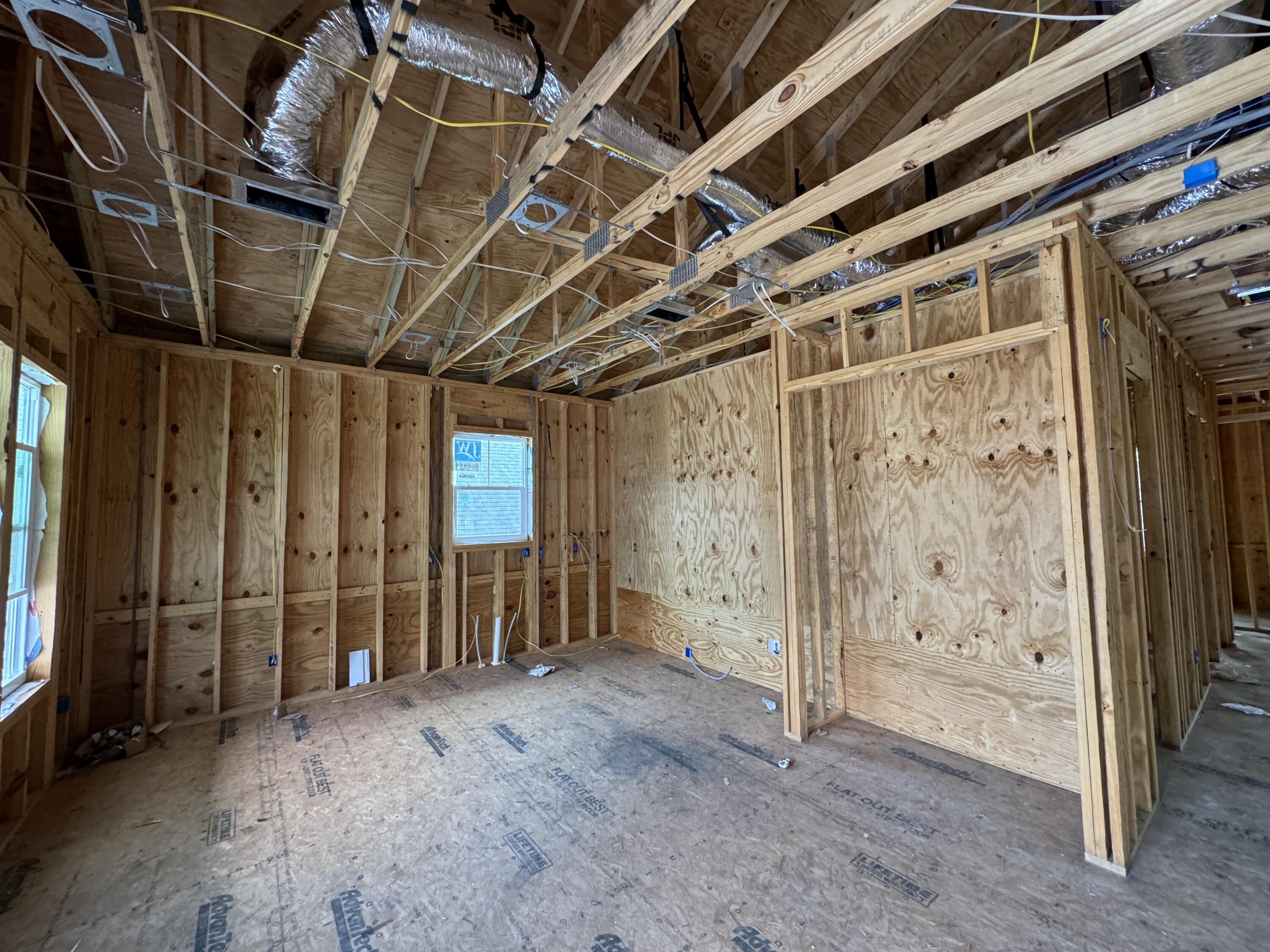 179 6th Street Santa Rosa Beach, FL 32459 - Photo 5 of 11 a view of an empty room with wooden walls