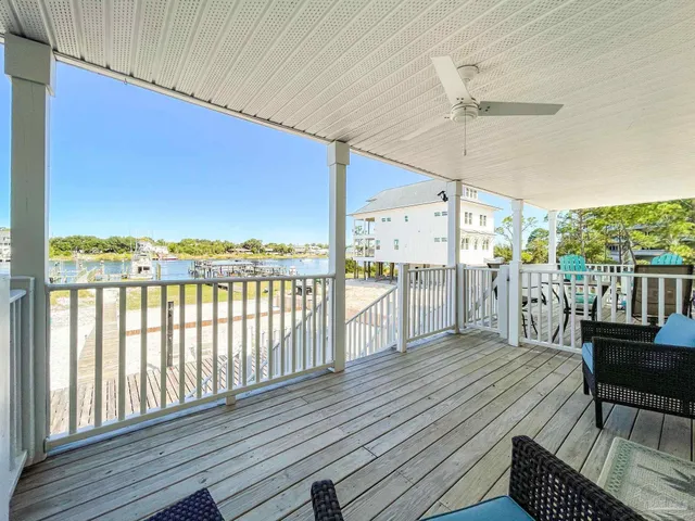 a view of a balcony with wooden floor