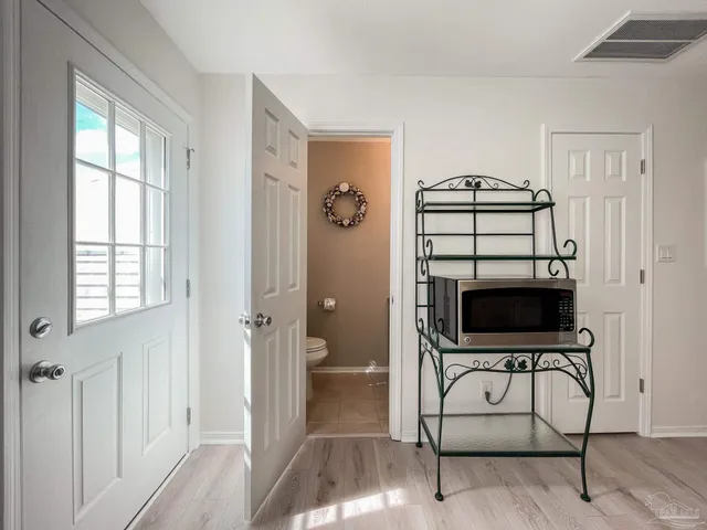 a view of a livingroom with furniture and a window