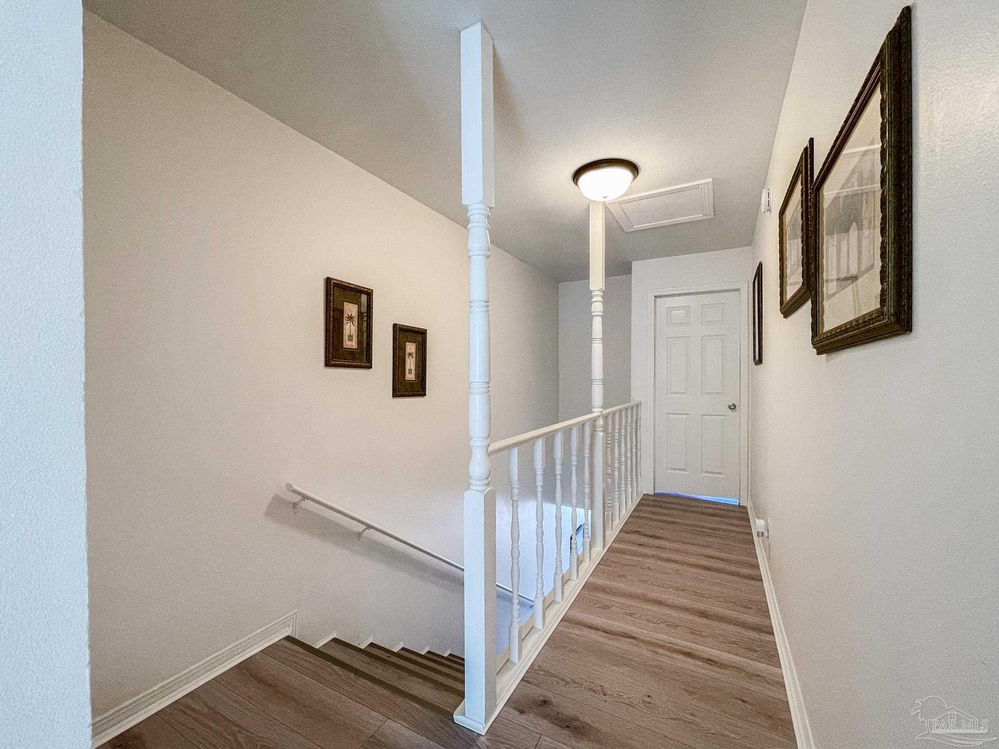 13948 River Road, Unit 3A Pensacola, FL 32507 - Photo 27 of 47 a view of a hallway with wooden floor and entryway