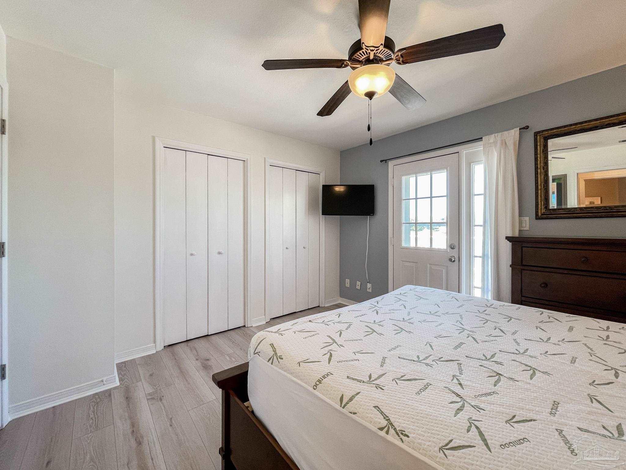 13948 River Road, Unit 3A Pensacola, FL 32507 - Photo 30 of 47 a bedroom with a bed and a window