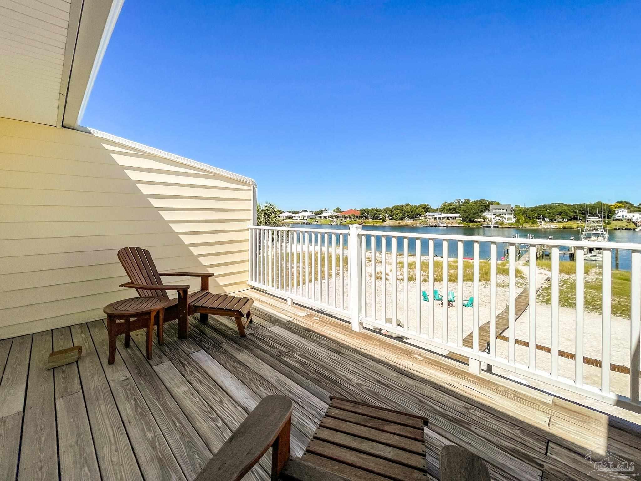 13948 River Road, Unit 3A Pensacola, FL 32507 - Photo 32 of 47 a view of a balcony with chairs