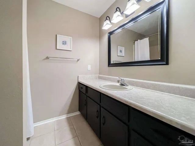 a bathroom with a sink a vanity and a mirror