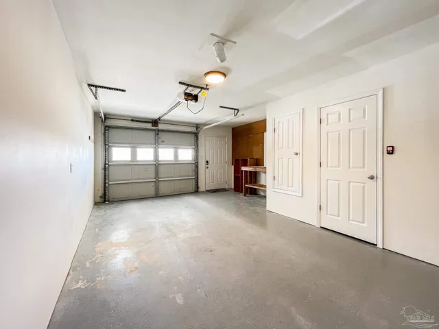 a view of empty room with ceiling fan