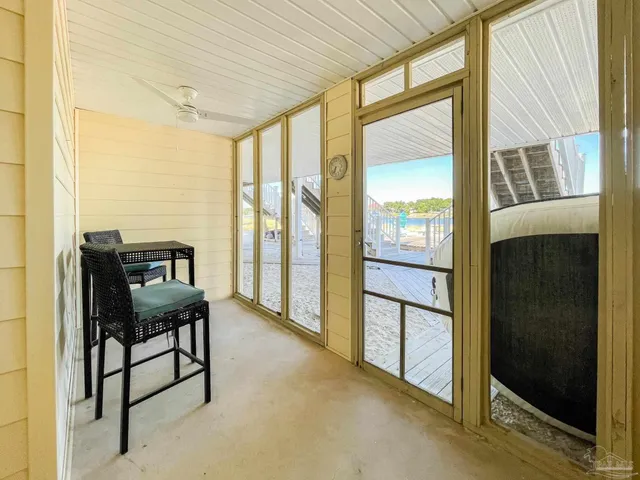 a view of a room with furniture and windows