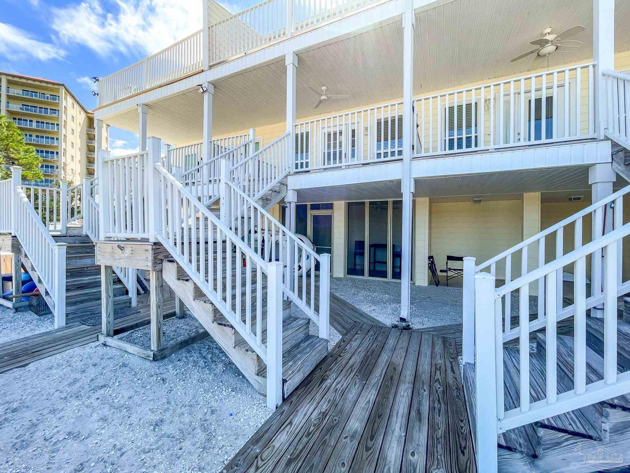13948 River Road, Unit 3A Pensacola, FL 32507 - Photo 46 of 47 a view of a house with wooden deck