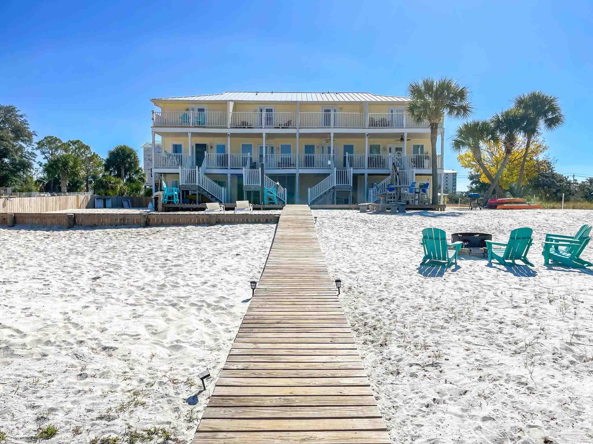 13948 River Road, Unit 3A Pensacola, FL 32507 - Photo 6 of 47 a front view of a house with a yard