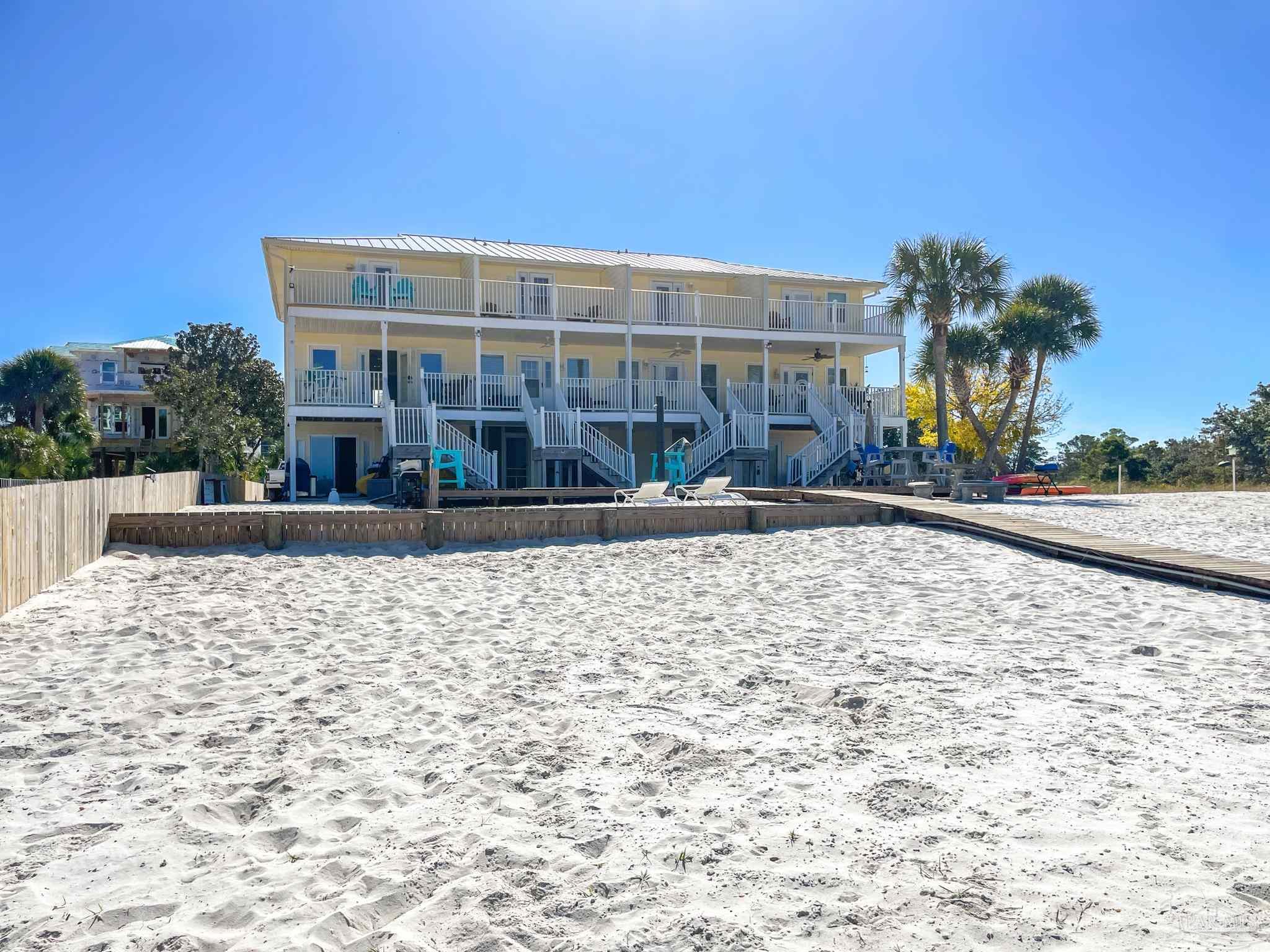 13948 River Road, Unit 3A Pensacola, FL 32507 - Photo 7 of 47 a view of a building with a yard