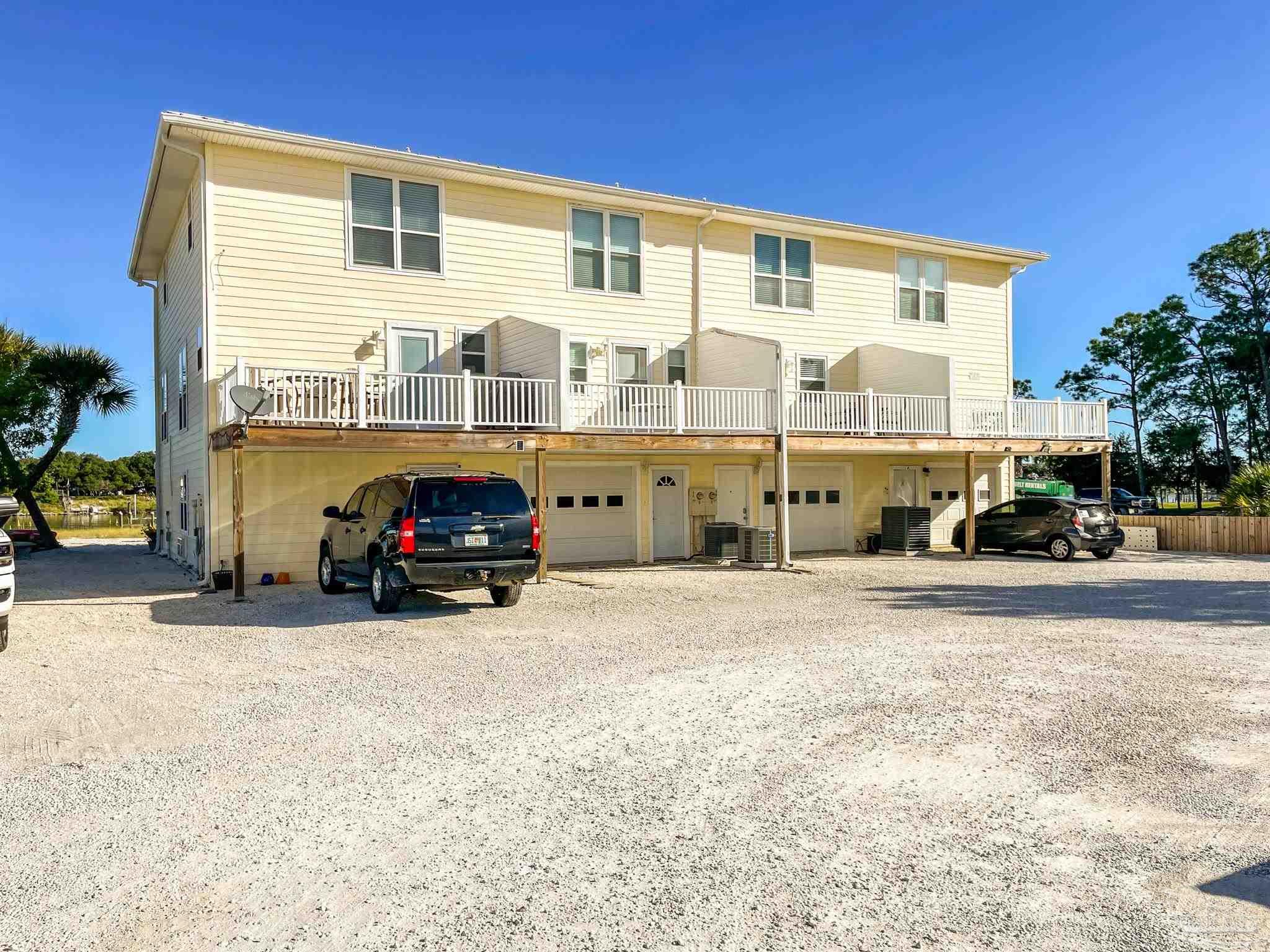 13948 River Road, Unit 3A Pensacola, FL 32507 - Photo 9 of 47 a car parked in front of a house