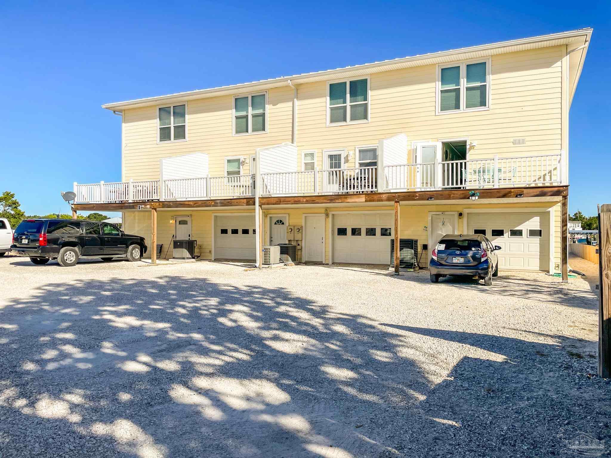 13948 River Road, Unit 3A Pensacola, FL 32507 - Photo 10 of 47 a car parked in front of a house