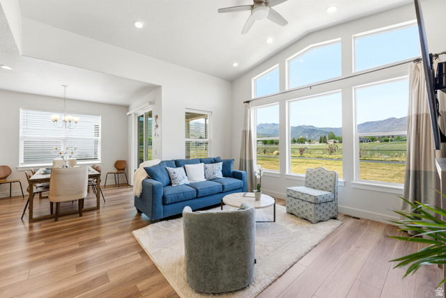 108 West Monte Rosa Lane Midway, UT 84049 - Photo 11 of 48 Living area featuring wood-finish flooring and a vaulted ceiling with recessed lighting