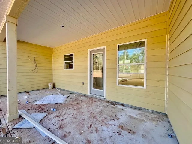 a spacious bathroom with a tub sink and a mirror