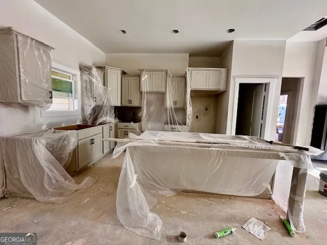 a kitchen that has a sink and a stove