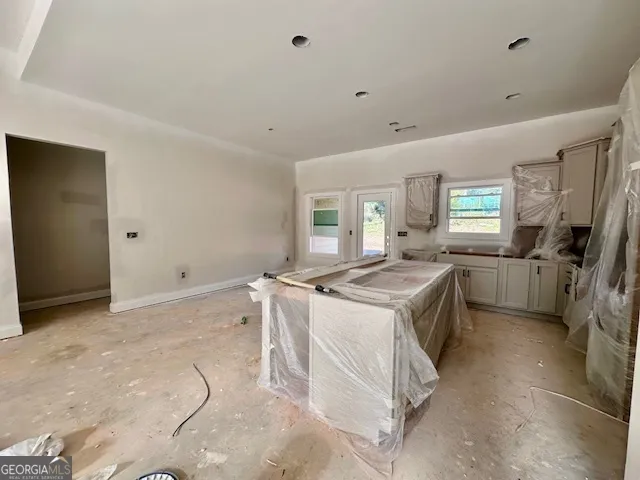 a spacious bedroom with a bed and a fireplace