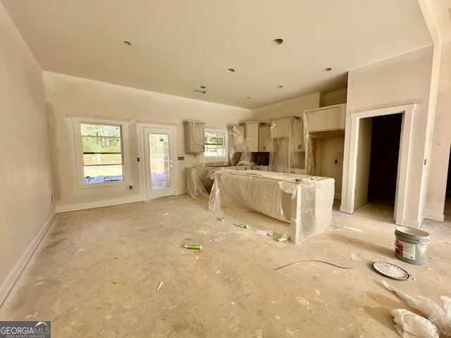 a view of a livingroom with furniture and a fireplace