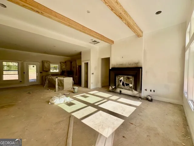 a view of a livingroom with furniture and a flat screen tv