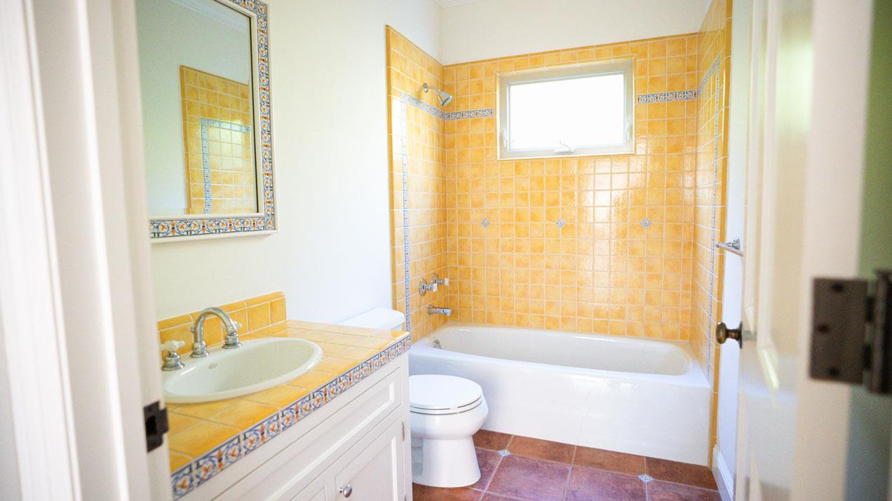 189 Kent Road Pacifica, CA 94044 - Photo 13 of 15 a bathroom with a granite countertop sink toilet and shower