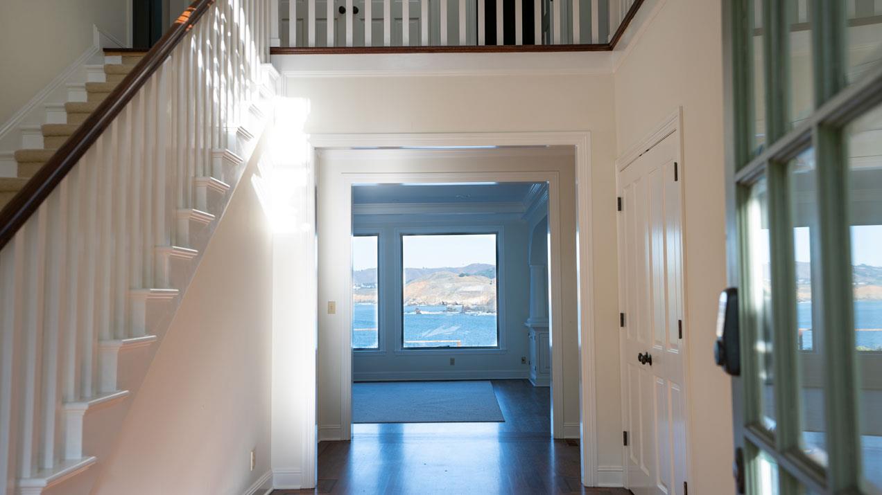 189 Kent Road Pacifica, CA 94044 - Photo 4 of 15 a view of a hallway with wooden floor and entryway