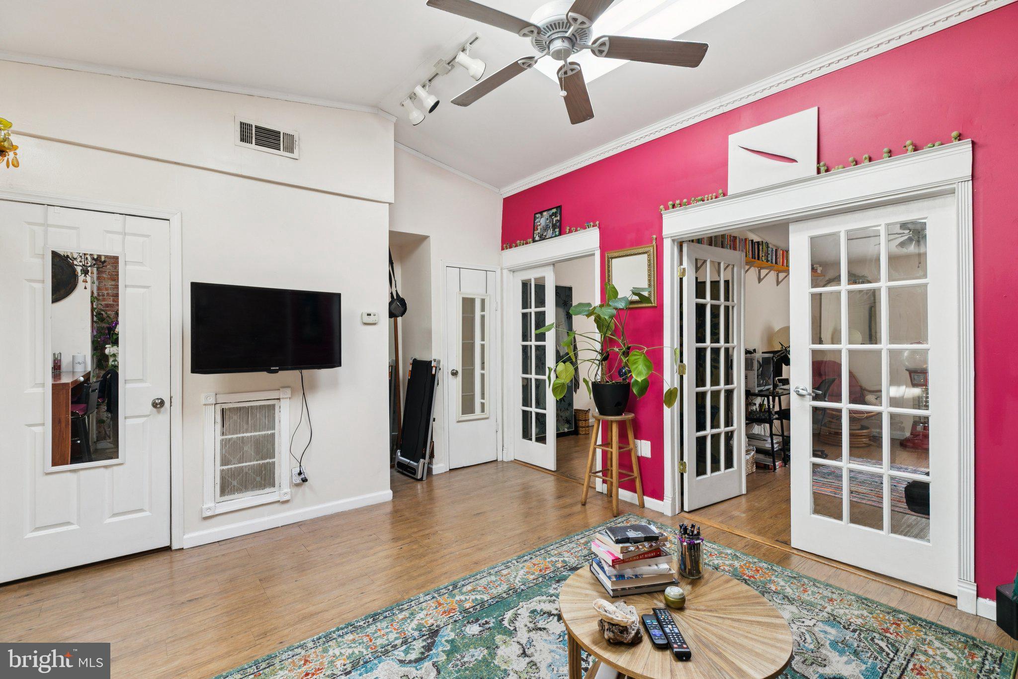 1333 Pine Street, Unit 4F Philadelphia, PA 19107 - Photo 11 of 20 a living room with furniture and a flat screen tv