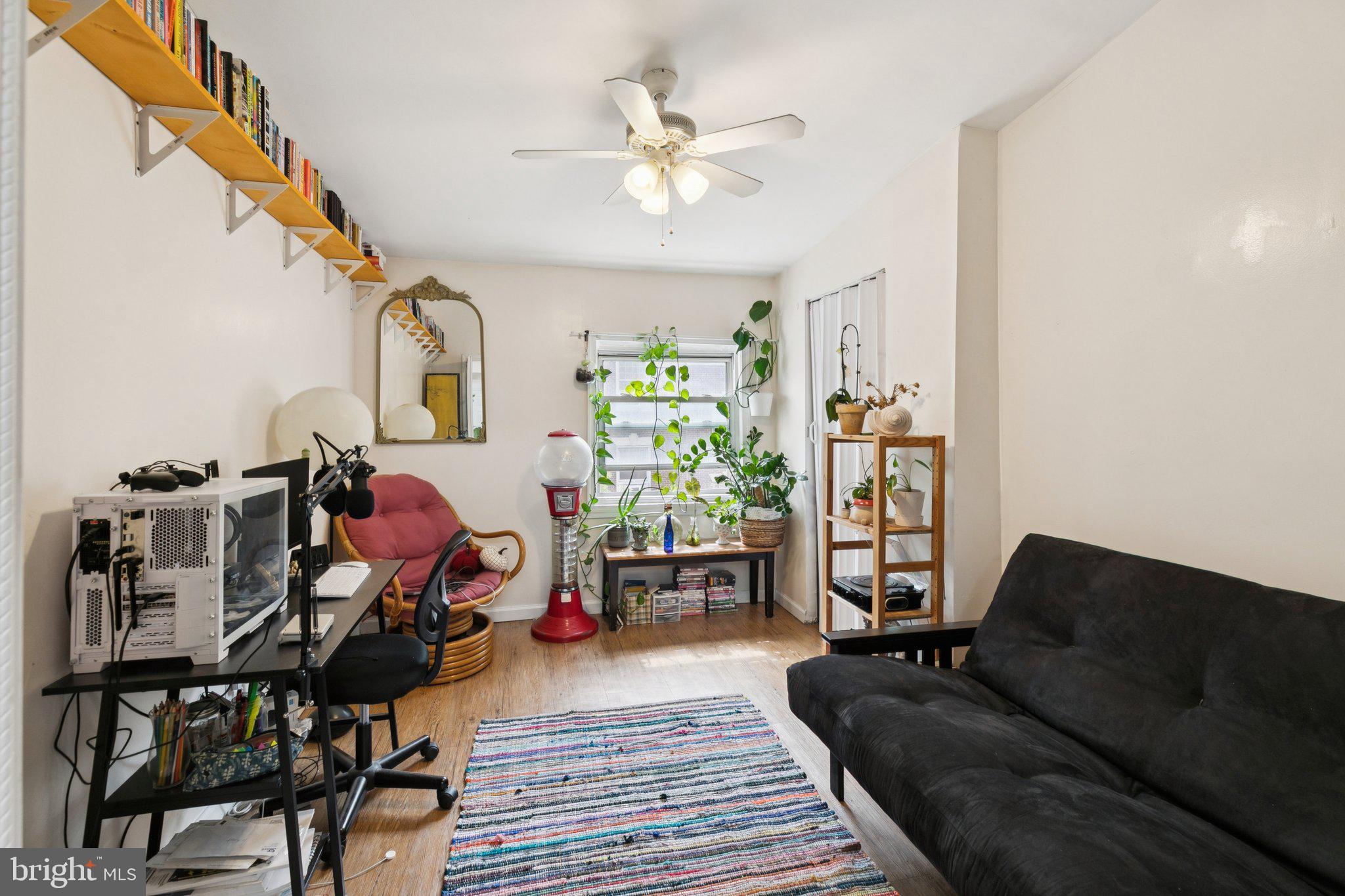 1333 Pine Street, Unit 4F Philadelphia, PA 19107 - Photo 12 of 20 a living room with furniture and wooden floor