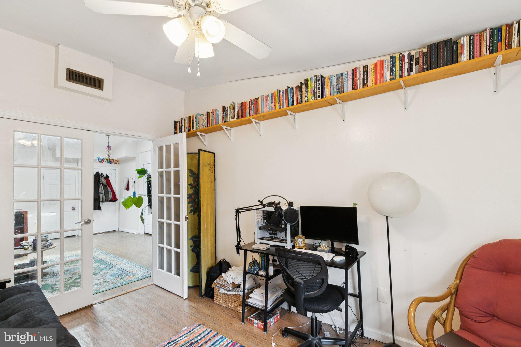 1333 Pine Street, Unit 4F Philadelphia, PA 19107 - Photo 13 of 20 a living room with furniture and a flat screen tv
