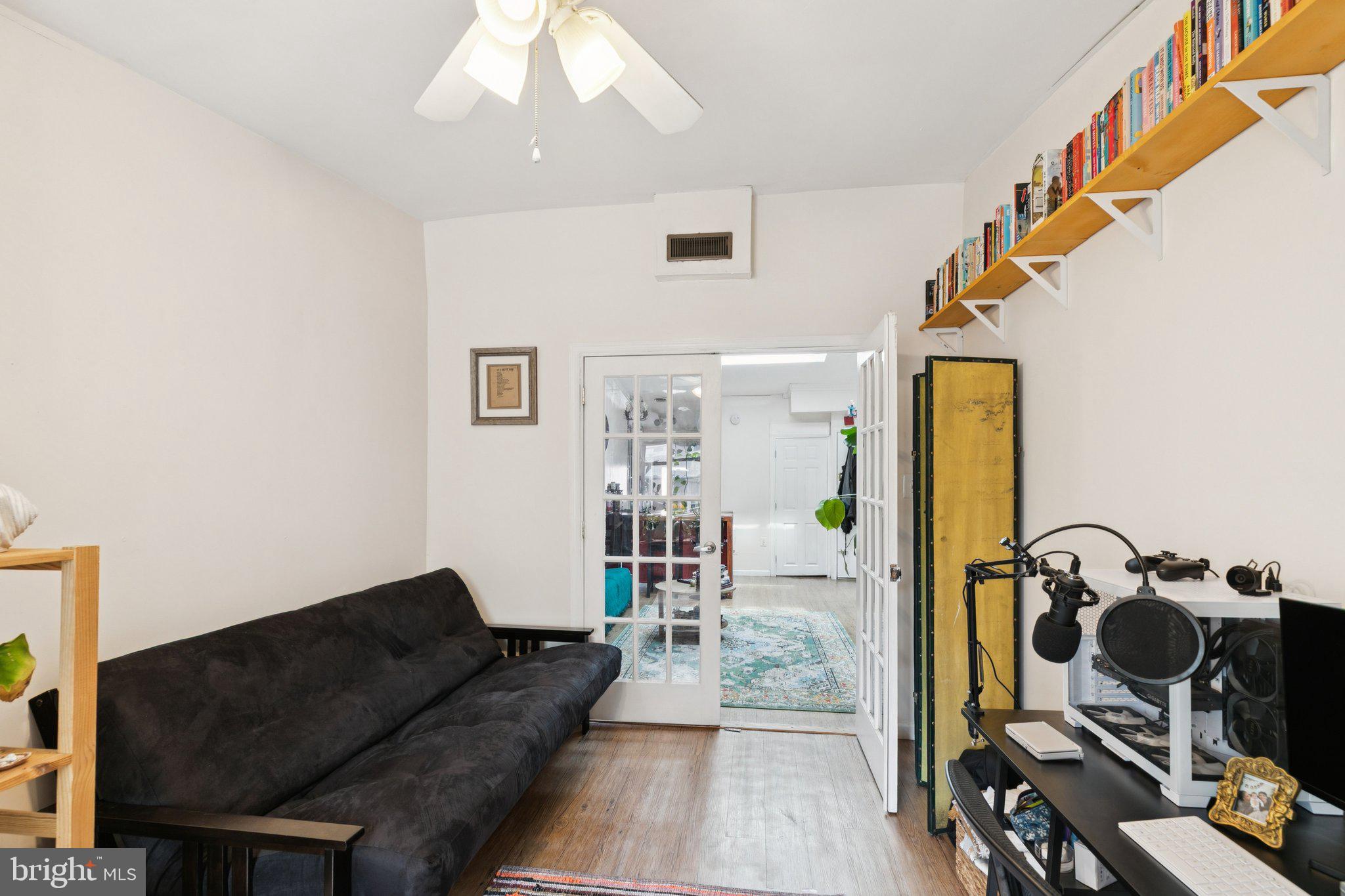 1333 Pine Street, Unit 4F Philadelphia, PA 19107 - Photo 14 of 20 a living room with furniture and a flat screen tv