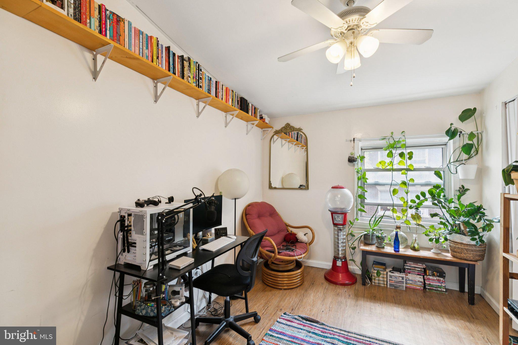 1333 Pine Street, Unit 4F Philadelphia, PA 19107 - Photo 15 of 20 a living room with lots of furniture and a chandelier