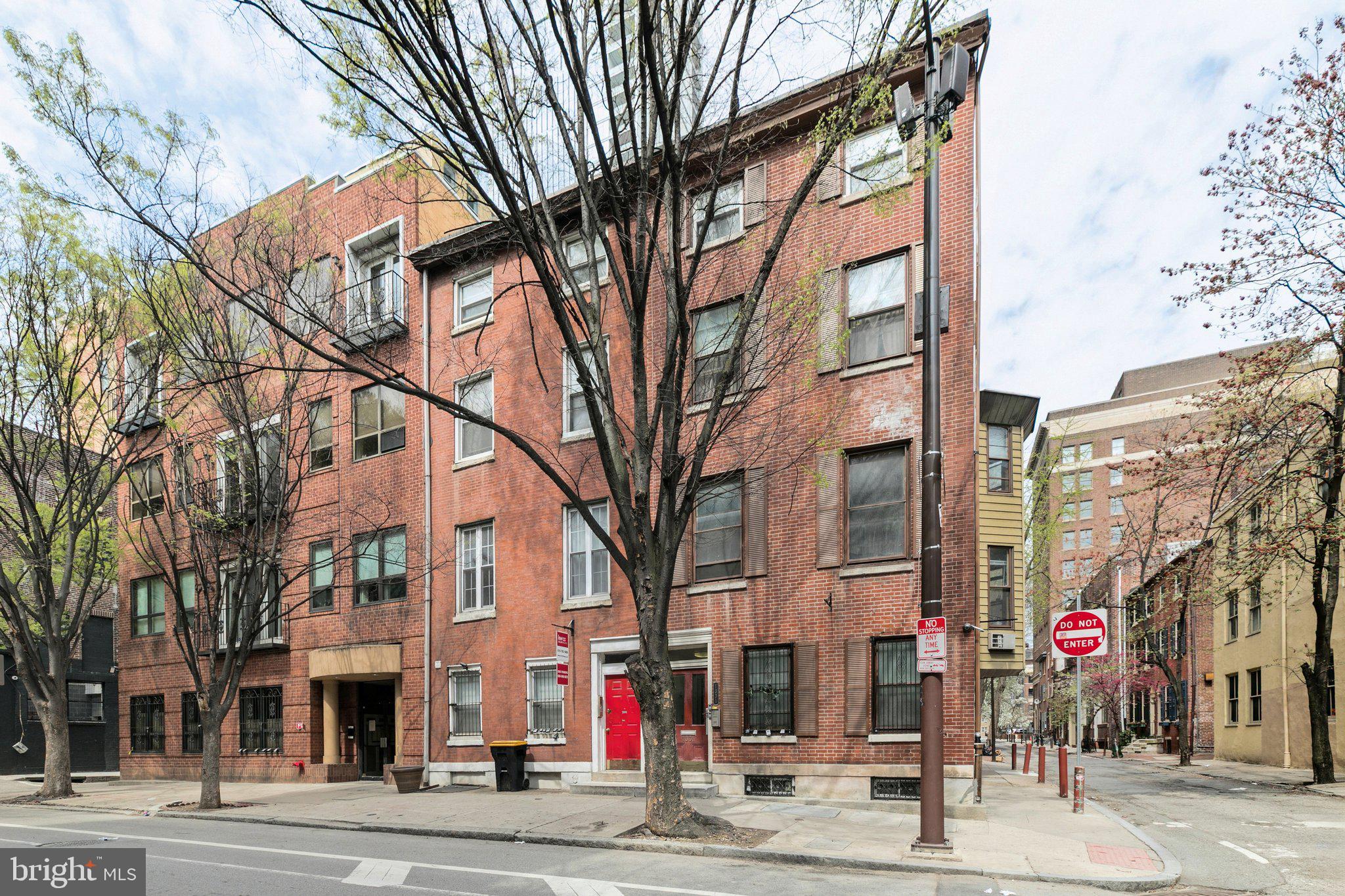 1333 Pine Street, Unit 4F Philadelphia, PA 19107 - Photo 20 of 20 a view of a city street lined with buildings and trees