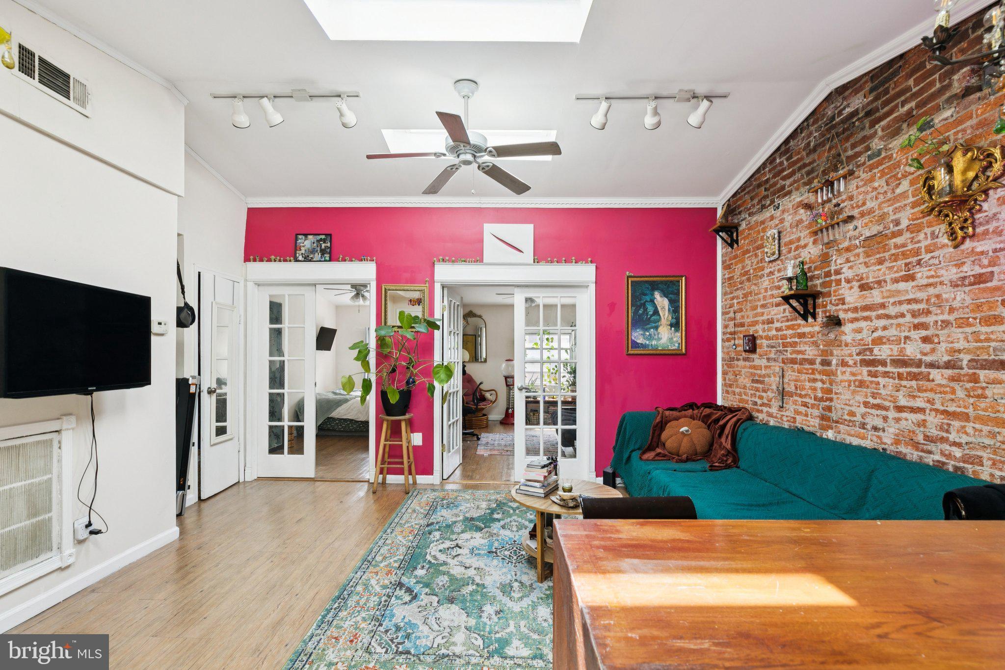 1333 Pine Street, Unit 4F Philadelphia, PA 19107 - Photo 2 of 20 a view of a livingroom with furniture a flat screen tv