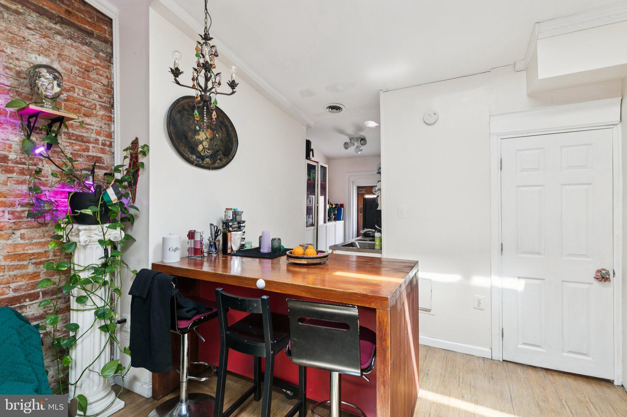 1333 Pine Street, Unit 4F Philadelphia, PA 19107 - Photo 6 of 20 a dining room with a table and chairs