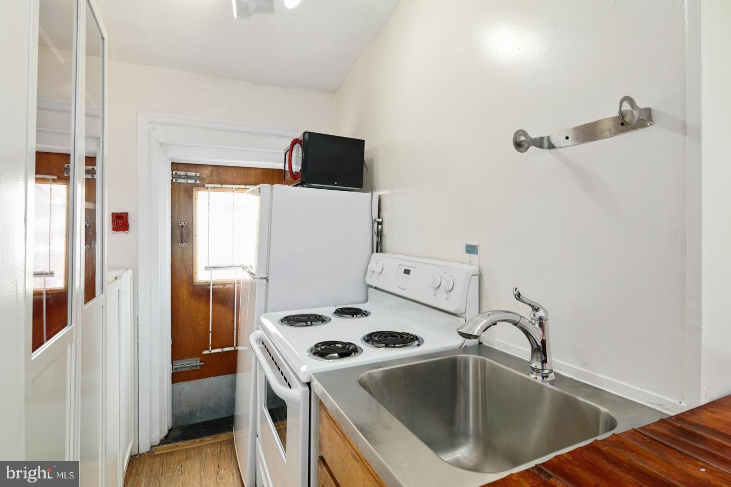 1333 Pine Street, Unit 4F Philadelphia, PA 19107 - Photo 9 of 20 a view of a storage and utility room with washer and dryer